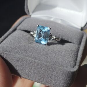 10k white gold blue topaz and diamond ring 7.25. This is in between about 3.5 -